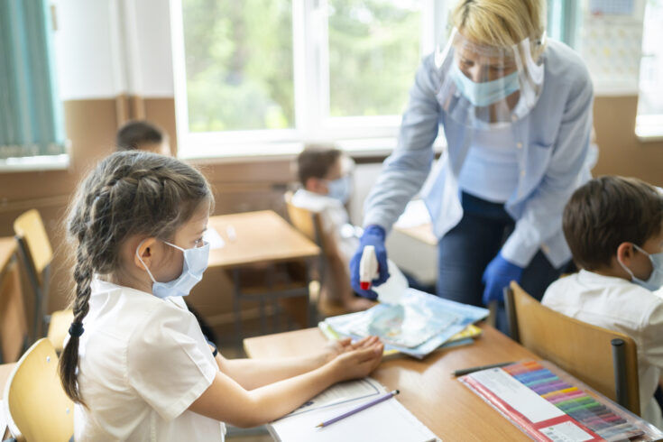 COVID-19. Using hand sanitizer in the classroom