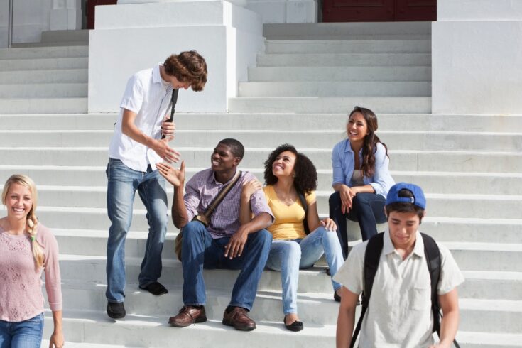 Students sat on steps of campus