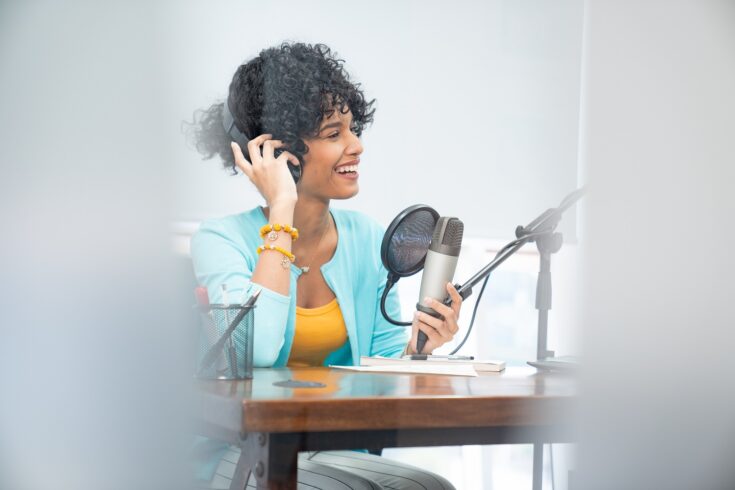 Woman recording a podcast