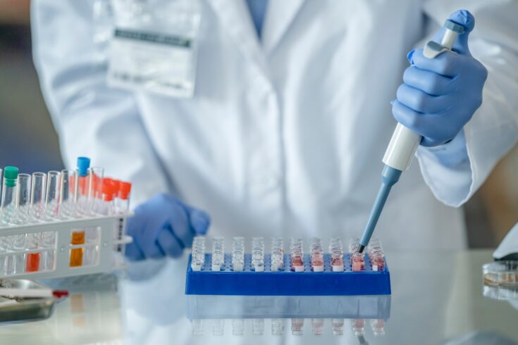 Researcher working in a scientific laboratory searching for a vaccine for COVID-19