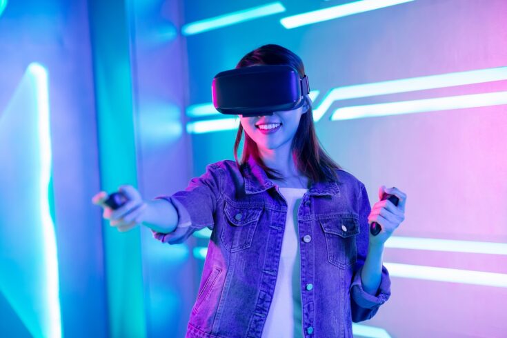 Young woman using VR headset