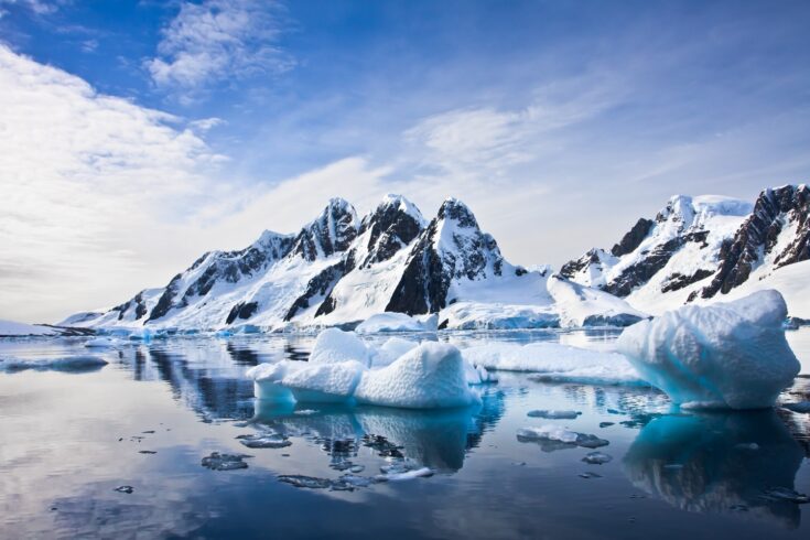 Beautiful snow-capped mountains against the blue sky in Antarctica