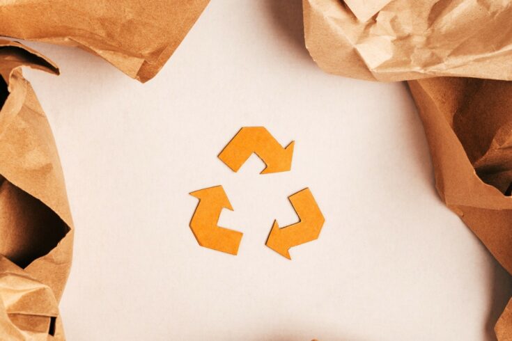 Brown recycle logo on white background