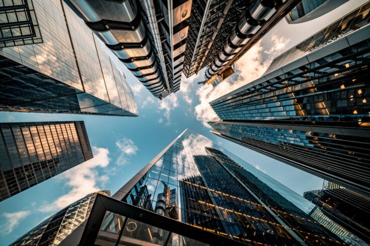 Looking directly up at the skyline of the financial district in central London