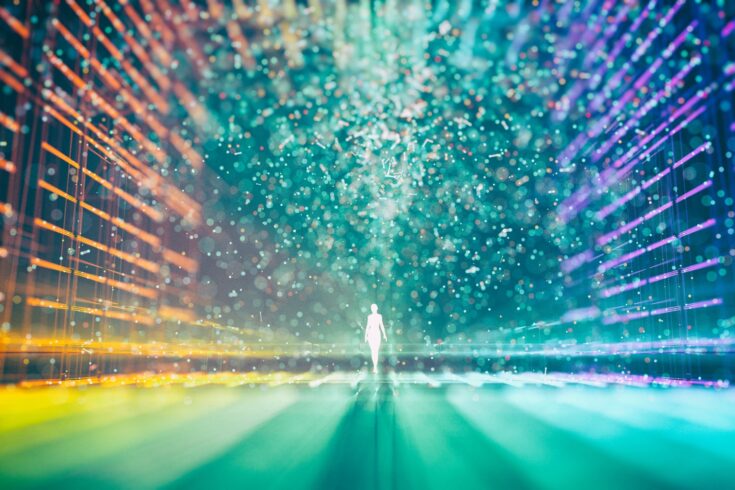 Abstract multicolored grid and a glowing figure surrounded by particles in the centre
