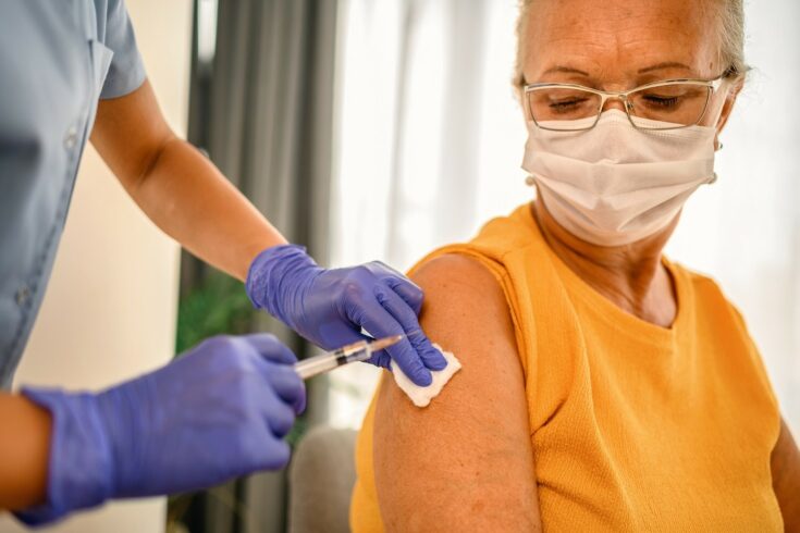Woman receiving a COVID-19 vaccine