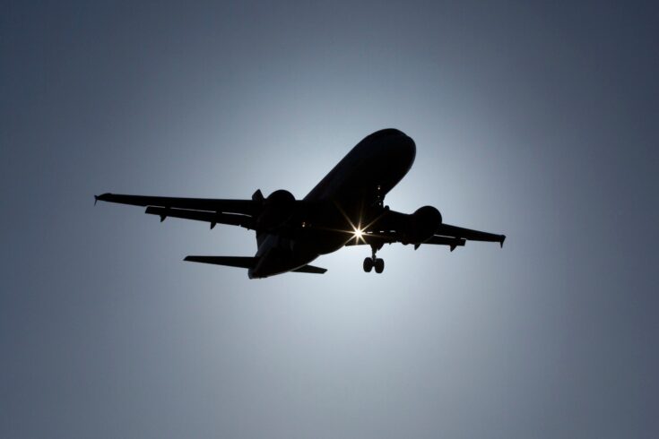 Silhouette of a plane coming into land