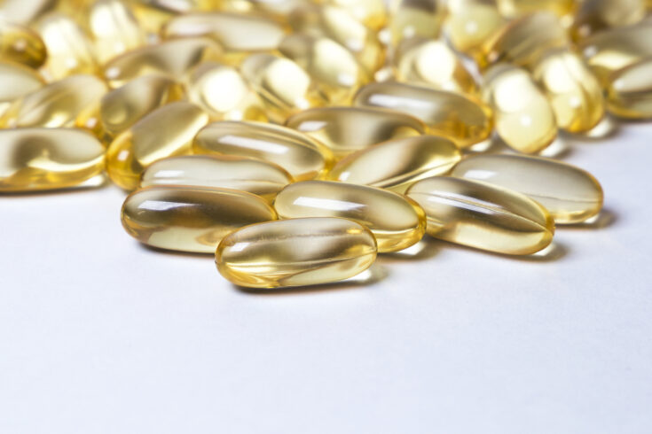 Omega 6: conjugated linoleic acid (CLA) in capsules on the white background