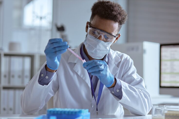 Young scientist working with samples in a lab