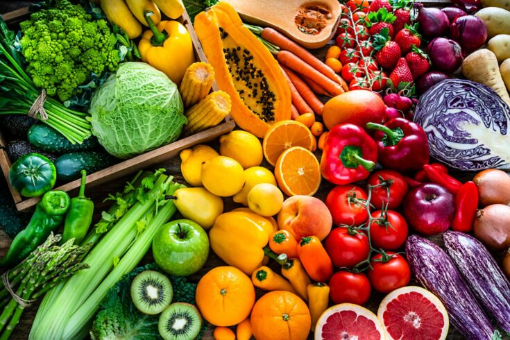 Healthy fresh rainbow colored fruits and vegetables background