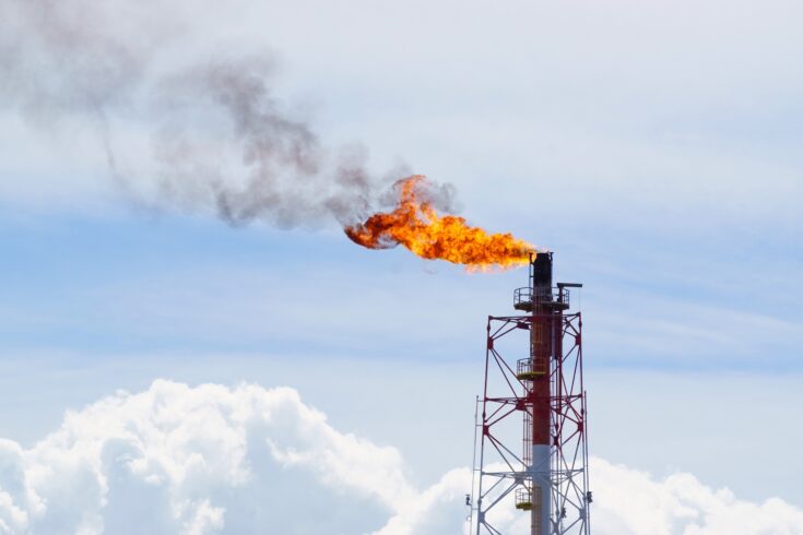 Fire torching against the sky, burning gas flaring