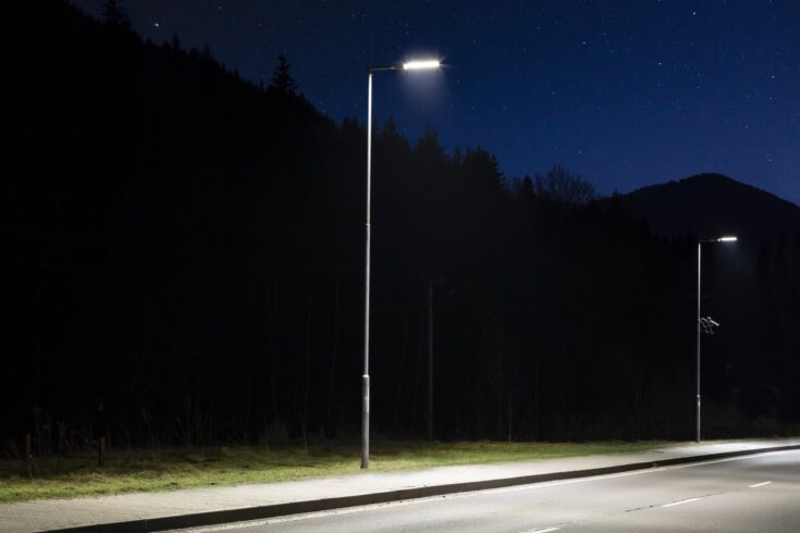 Two modern streetlights, LED, empty road