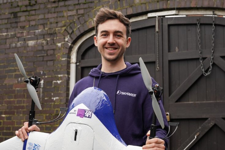 Man holding autonomous drone