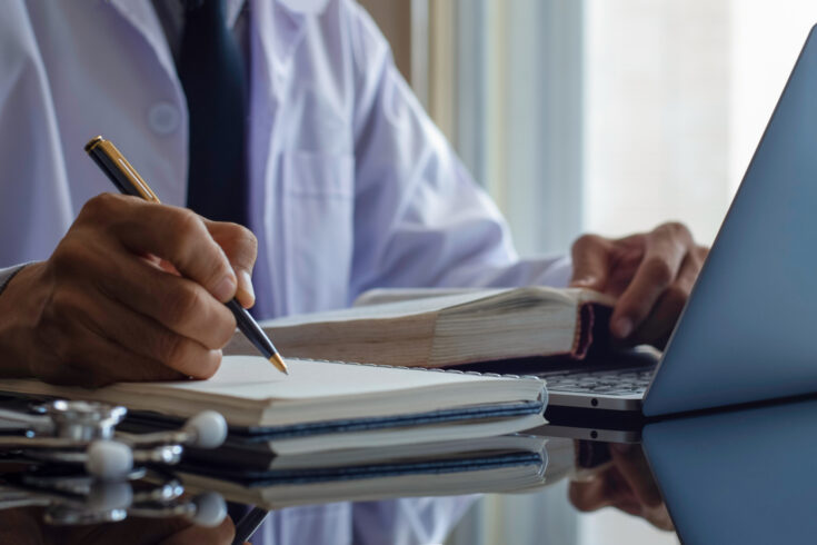 Researcher writing up notes