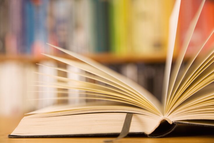 Open book with a leather bookmark