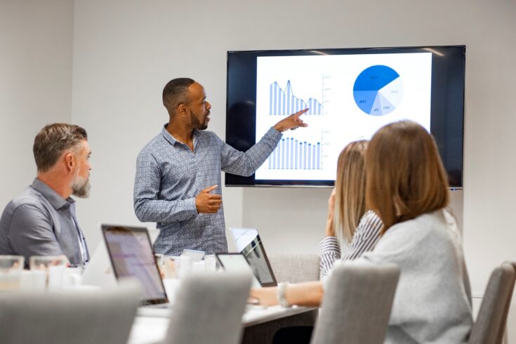 Businessman giving presentation with colleagues