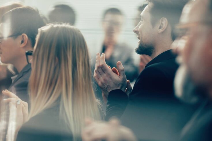 Business people applauding at awards ceremony