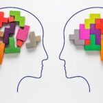 Heads of two people with colourful shapes of abstract brain - stock photo