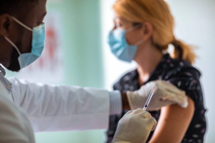 Doctor administering vaccine