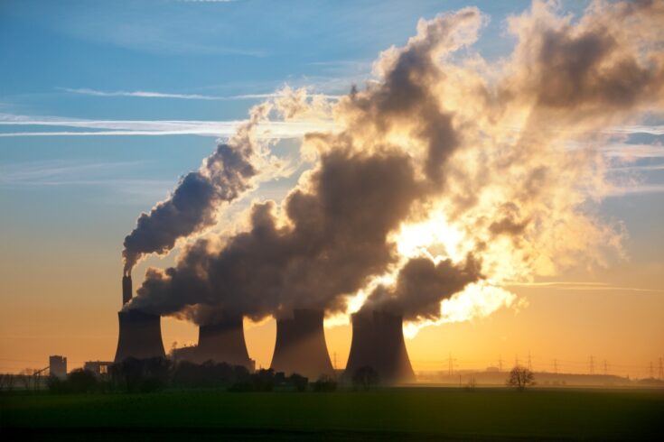 Late afternoon sun through the steam from the cooling towers of a power station in Leicestershire