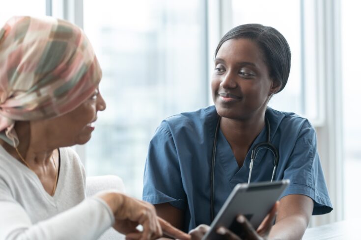 Female doctor consults patient with cancer