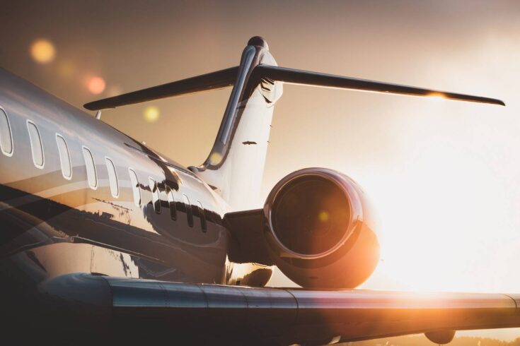 Corporate passenger jet at sunset