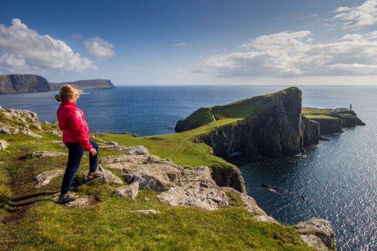 Walker looking out at the view from Nest Point, Isle of Skye