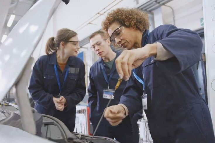 Mechanics working on a car