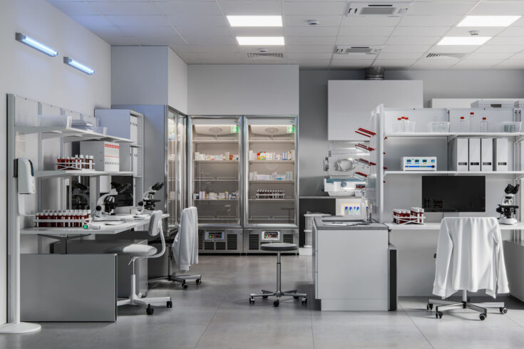 Interior of a science laboratory with computer desks and microscopes.