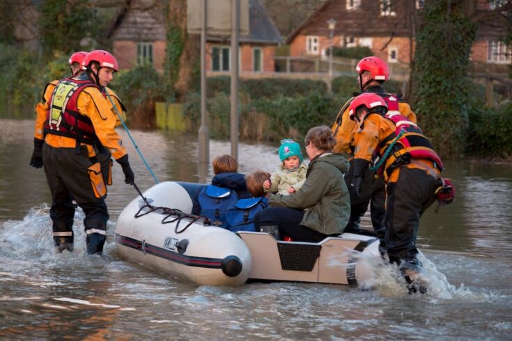 Family being rescued from a flood