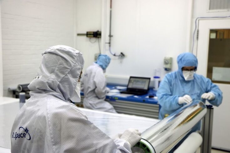 Women work on making thermal space blankets