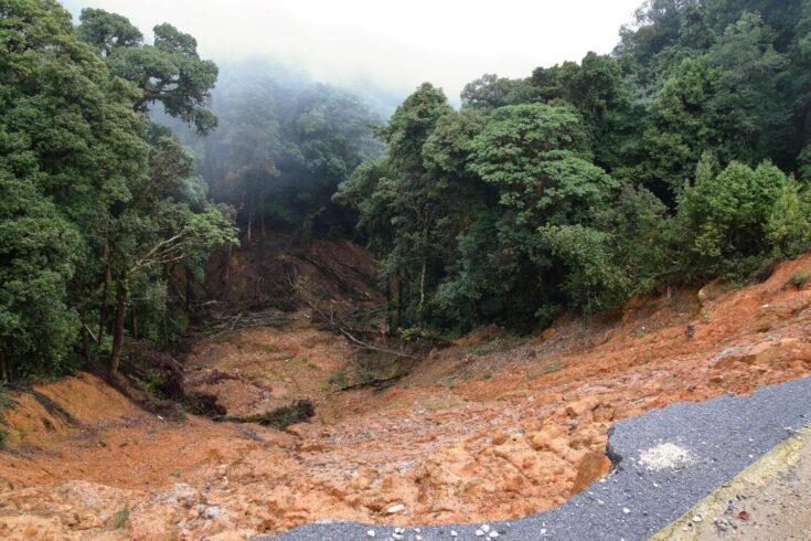 Collapse asphalt road cause by heavy rain due to foothill landslide