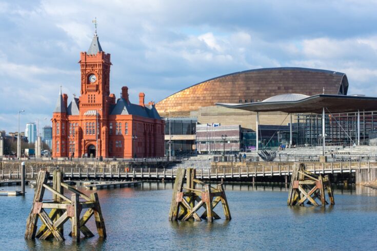 Cardiff Bay at dusk, the Pierhead building (1897) and National Assembly for Wales can be seen over the water.