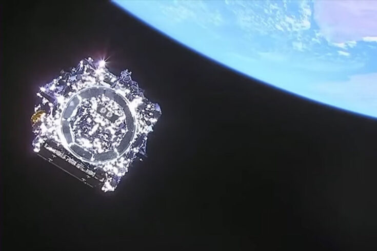 Humanity’s final look at the James Webb Space Telescope as it heads into deep space. The Earth hover in the upper right.