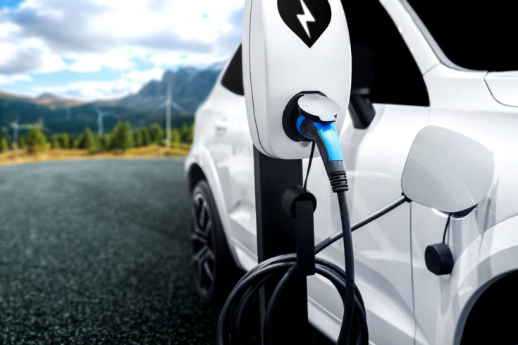 EV charging station for electric car in concept of green energy and eco travel. The electric power is produced from sustainable resource to supply to charger station in order to reduce CO2 emission.