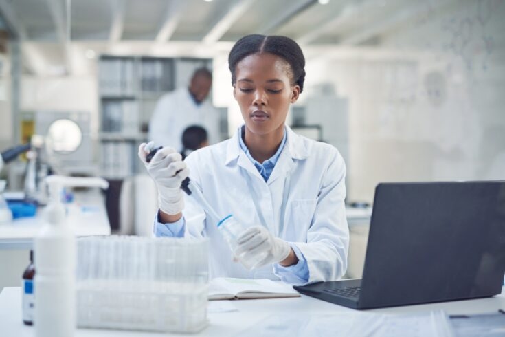 A young scientist conducting research in a laboratory