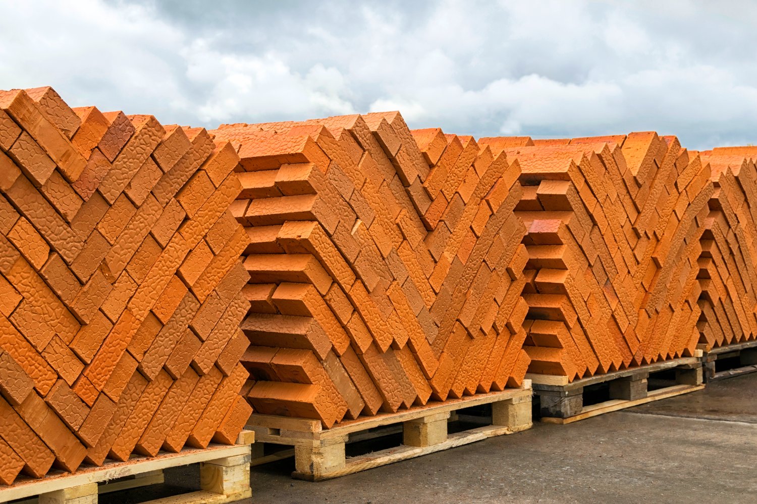 Facing red bricks stacked on pallets