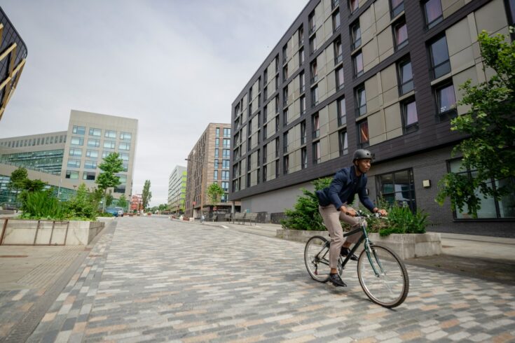 Commuting businessman riding bicycle in the city