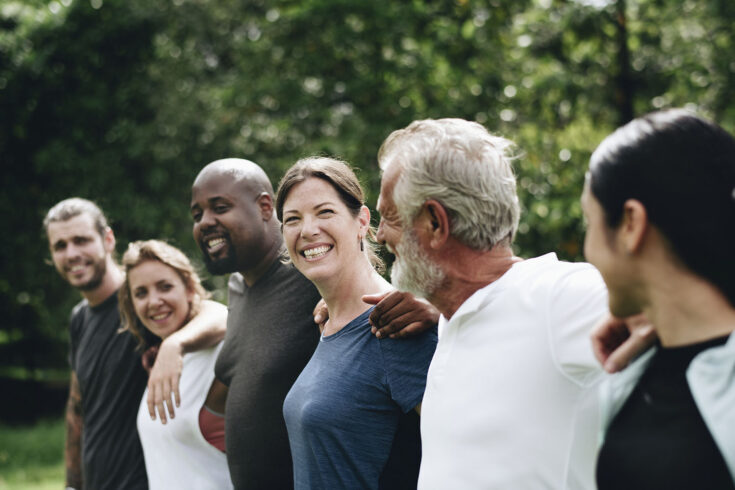 Happy diverse people together in the park.