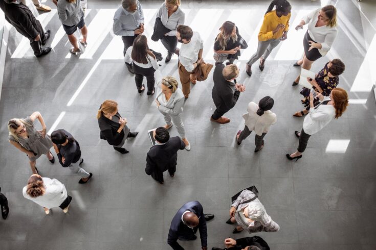 A diverse group of business people networking at a conference event