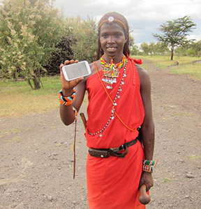 African woman holding smartphone