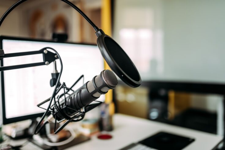 Radio studio with microphone and computer screen