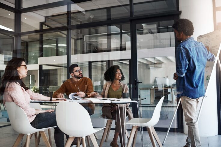 Shot of a group of designers having a meeting in an office