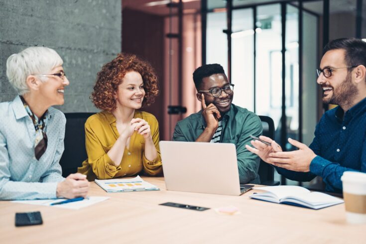 Multi-ethnic group of business persons having a meeting in the office