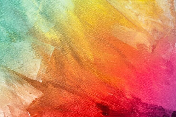 Canvas painted with harsh strokes of green, yellow, orange, red and pink