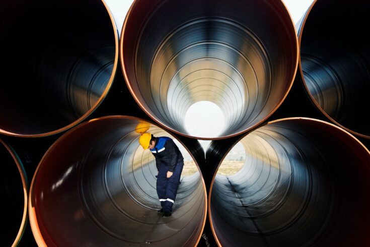 Water engineer checking pipes