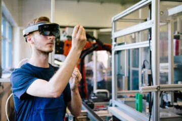Young engineer works with a head-mounted display