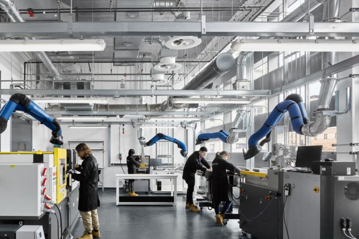 Workers inside the Graphene Engineering Innovation Centre Composites Lab