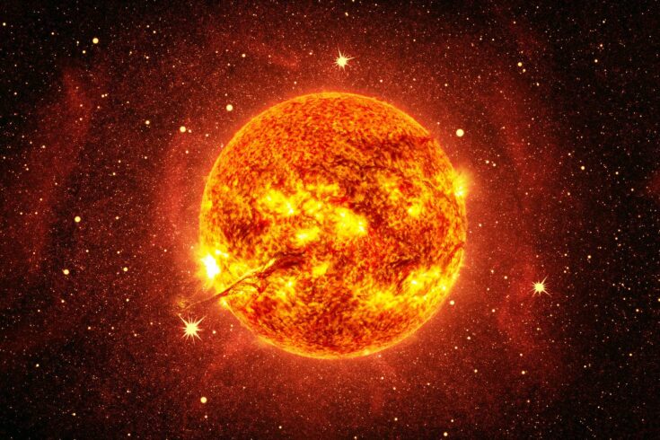 Sun with stars in space