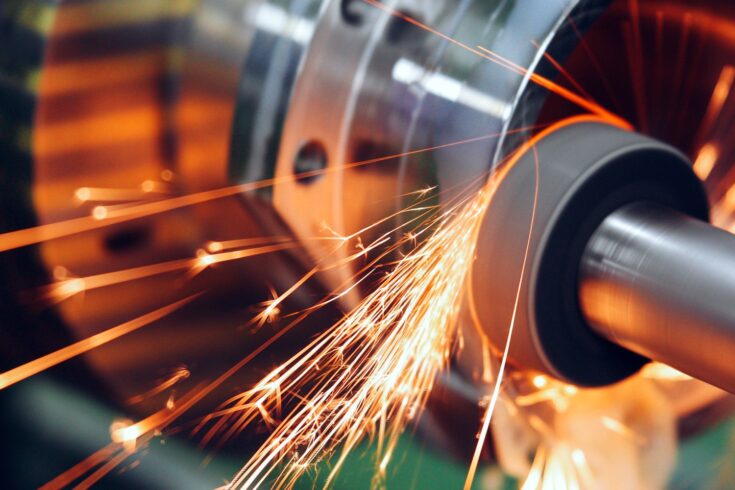 Sparks flying while machine griding and finishing metal